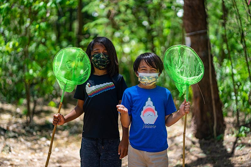 Kids holding a bug net