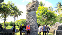 UOG’s CM394 class stands by the Guma’ Taga latte stone in Tinian. 