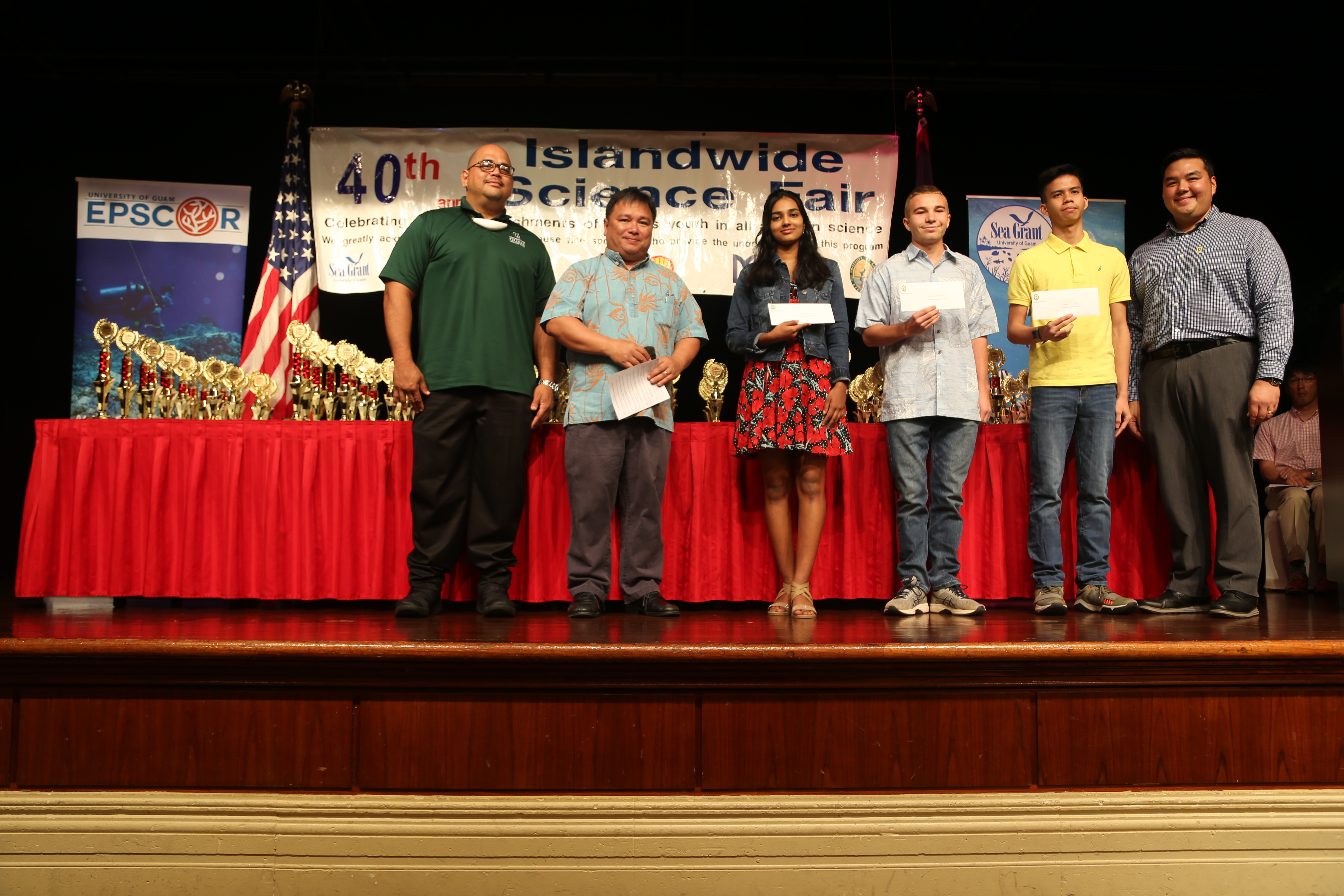 Winners of the University of Guam Summer Internships (from left to right) UOG Reference and Instruction Librarian, Roland San Nicolas, UOG Associate Professor of Biology Dr. Frank Camacho; Heera Kodiyamplakkal, Grade 10, St. John’s School; Donovan Nelson, Grade 10, Father Duenas Memorial School; Jerome Ariola, Grade 10, John F. Kennedy H.S.; and UOG Assistant Professor of Extension & Outreach Dr. Austin Shelton.