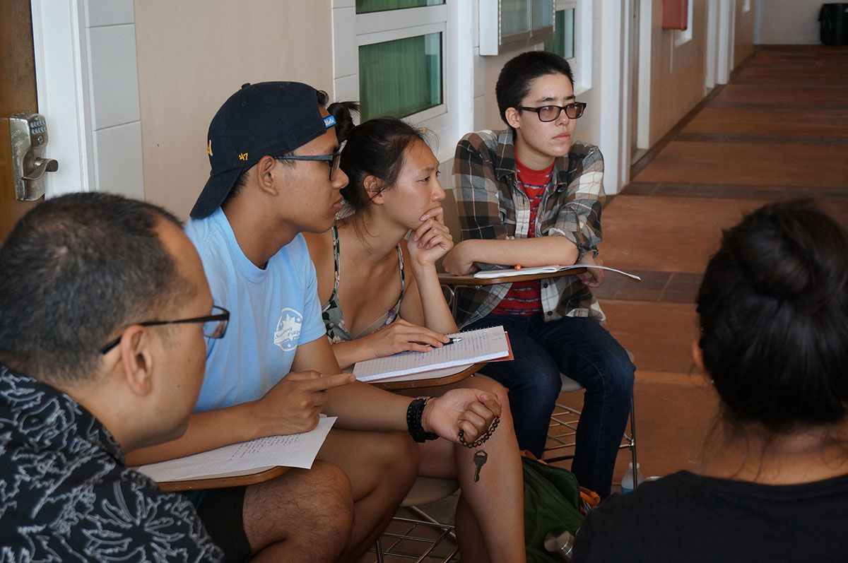 (From left) Keith L. Camacho, Associate Professor in the Asian American Studies Department at the University of California, Los Angeles, and instructor for the UCLA Guam Travel Study Program, far left, listens in as UCLA students (from left) Harold Caylao, Veronica Giap, and Kyla Worrell are briefed by representatives of their service-learning organization. 