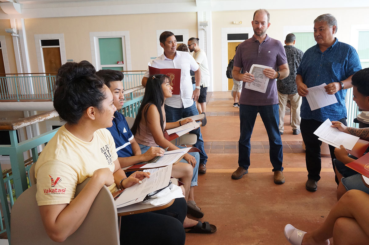 (Standing from left) Victor Camacho, Program Officer of Guam Preservation Trust; Aaron Burger with the American Institute of Architects; and Joseph E. Quinata, Chief Program Officer of Guam Preservation Trust kick off their service-learning project with UCLA Guam Travel Study Program students (seated from left) Melissa Aliu, Daniel Luu, and Mishka Caruncho. 