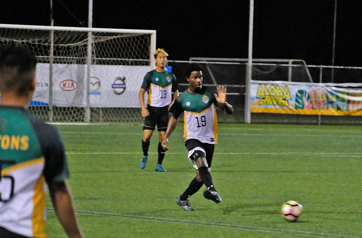 Jacque Diambra dribbles the ball down the field