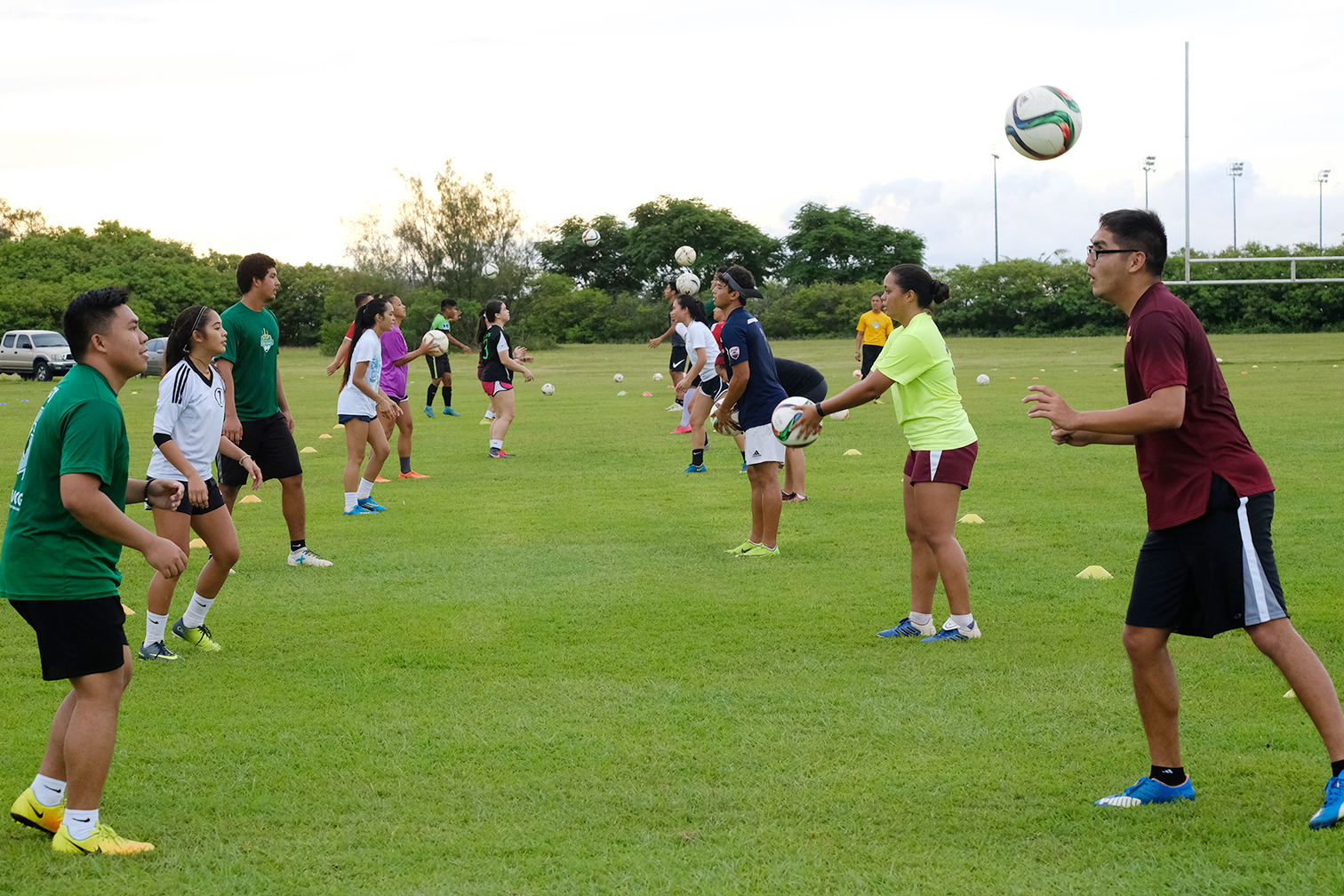 Photos - Coach Hidalgo working with team & players learning skills - Photos by UOG Sports Photographer, Victor Consaga