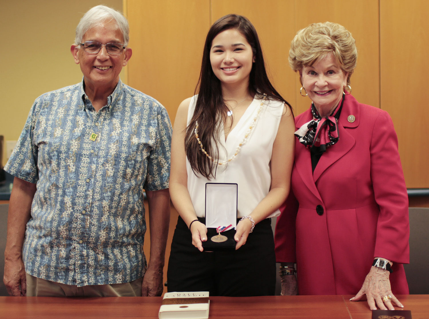 Athena McNinch (center), Dr. Robert Underwood (left) and Madeline Bordallo (right)