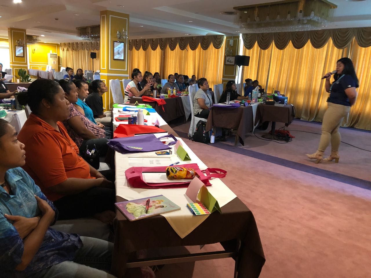 Shannel Leon Guerrero, a graduate student studying special education at the University of Guam, presents her research project to parents and teachers of students with disabilities in Palau. 