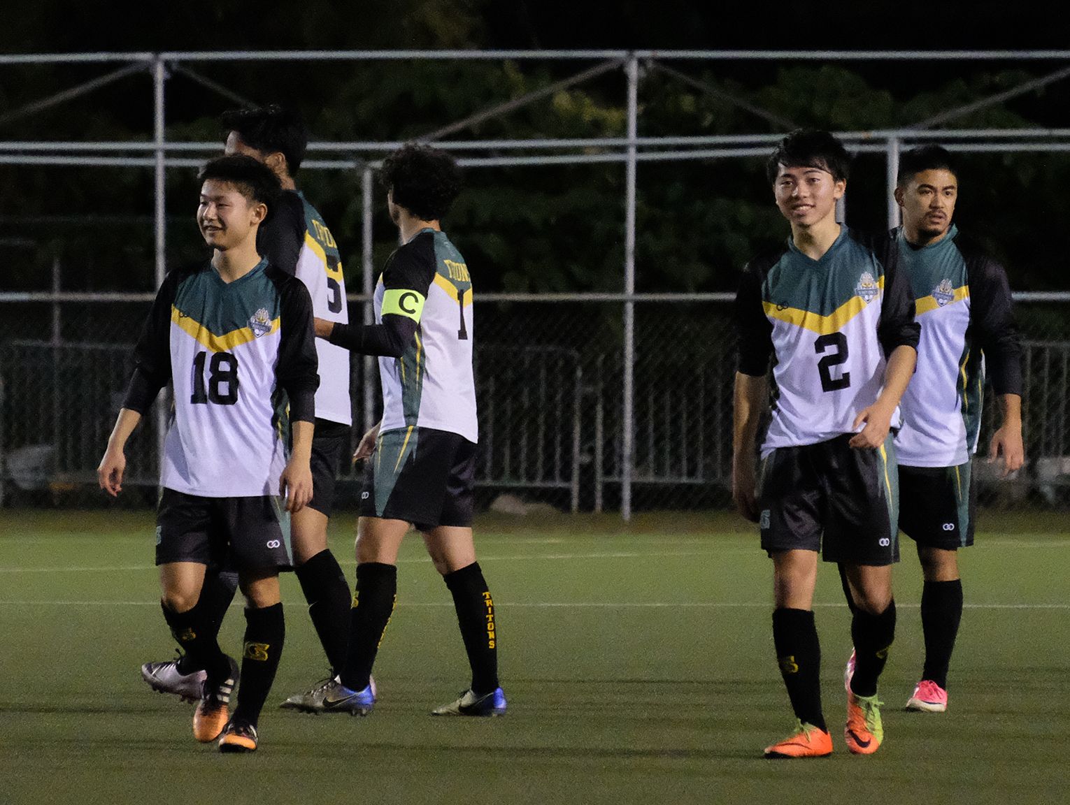 Japanese exchange students Ryoga Okada, No. 2, and Ichiyo Kawamata, No. 18, in their first match for UOG against the Guam Shipyard