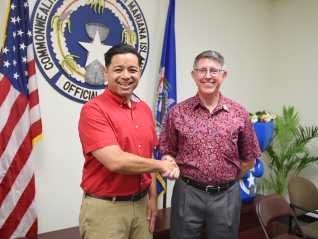 UOG President Thomas W. Krise with NMC Interim President Frankie Eliptico in Saipan.