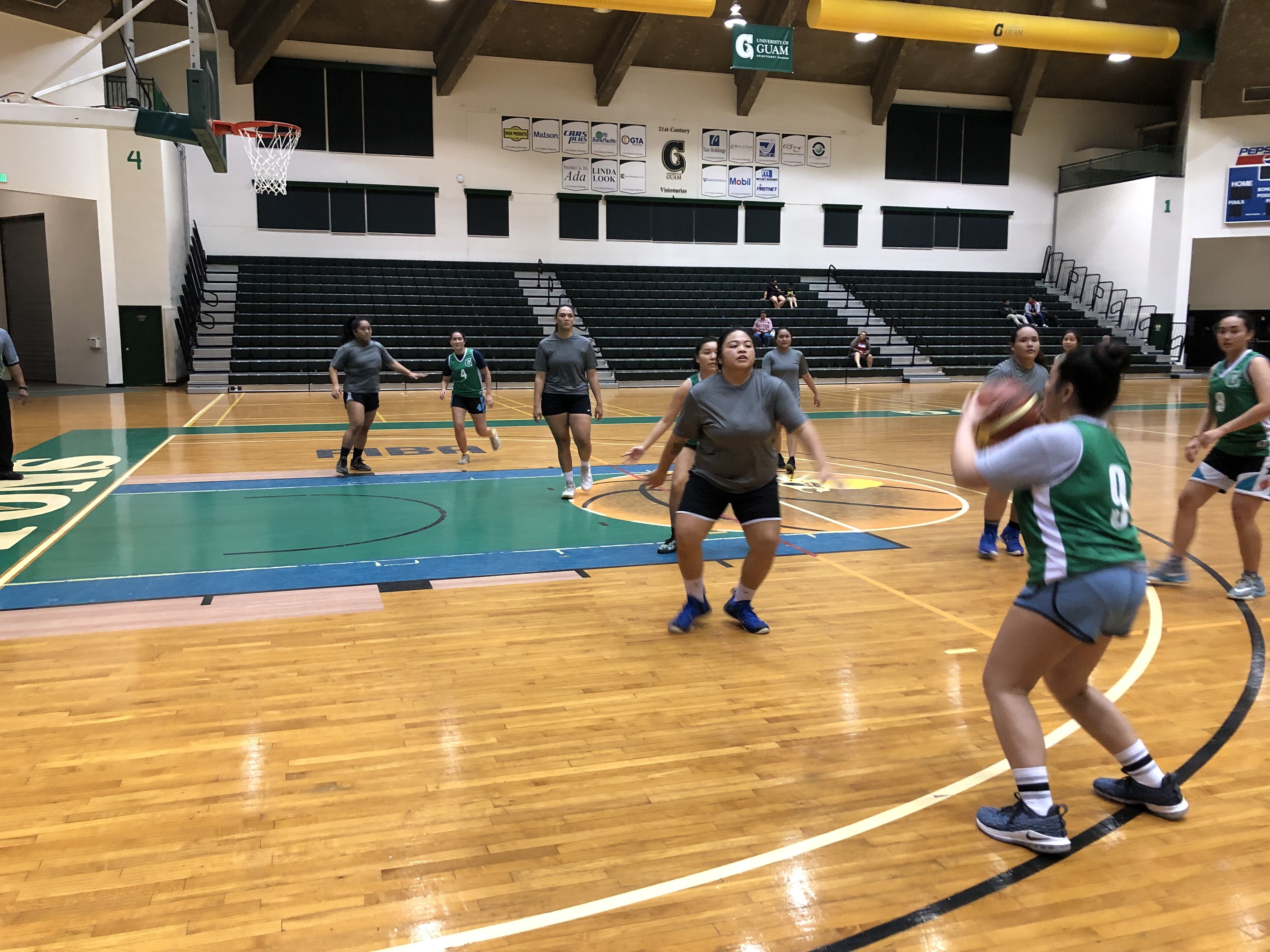 UOG Trident Izzy Abad makes a shot over the GCC defense.