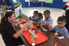 Clarissa Barcinas preparing food portions for children as part of the 