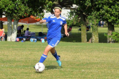 Gracia Magrath dribbles a soccer ball