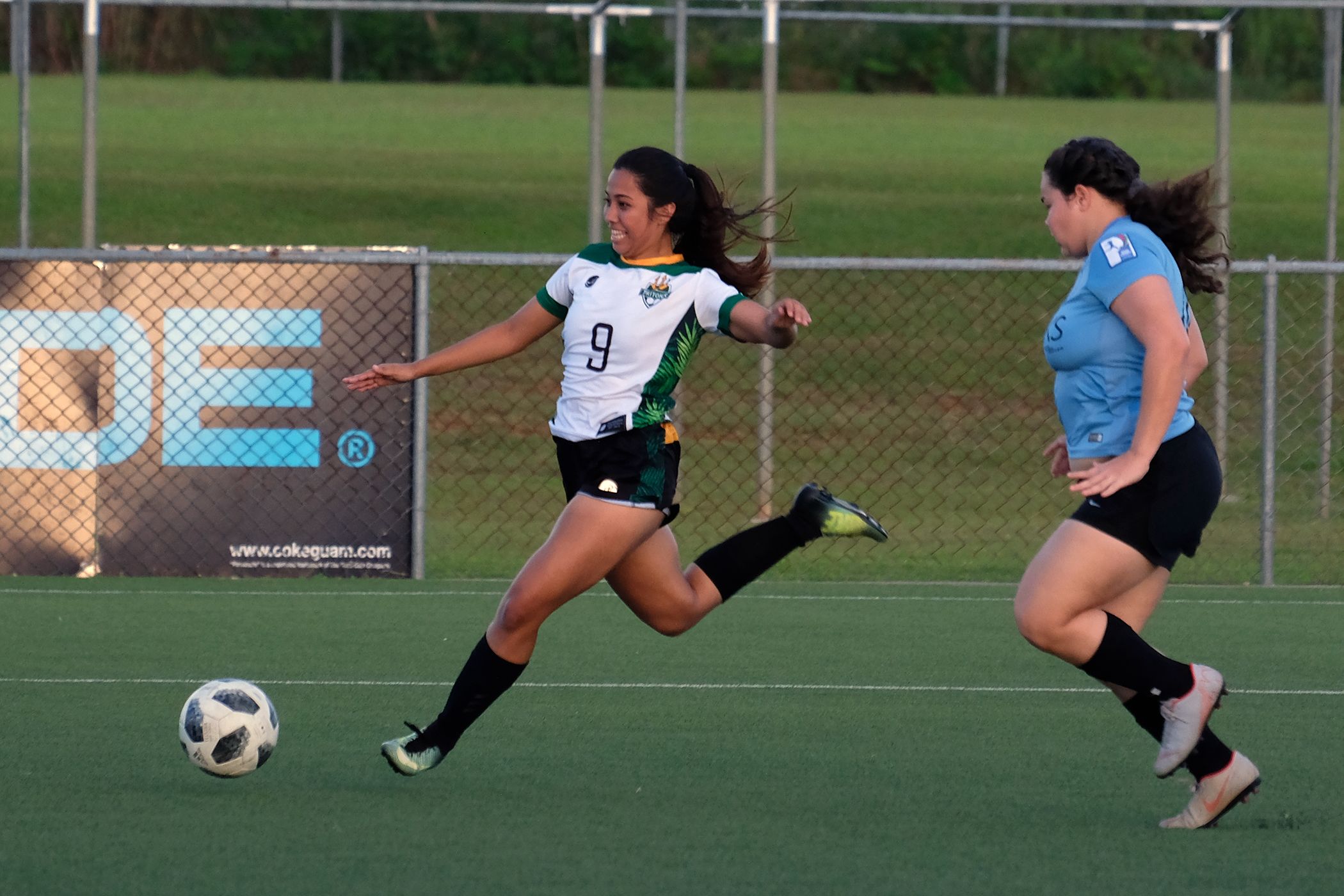 UOG Women's Soccer goes to 4-0 in victory over Sidekicks  The University of Guam Women's Soccer Team kept its undefeated streak going with a 4-0 victory over the Venue Sidekicks on Nov. 18 in the Guam Football Association's Bud Light Amateur Women's League at the GFA National Training Center.   The Sidekicks came out strong and dominated the first few minutes of the first half, keeping the ball in their offensive end, but the Lady Tritons began to shift the ball to their offensive end of the field as the game moved forward.   The UOG defense began to solidify during the match as the Sidekicks could never break past the UOG defensive line to get a shot on the goal, and the Tritons began to move past the Sidekicks' defense for several fast break attempts on goal.   The Lady Tritons opened the scoring at about the 20-minute mark and led 1-0 at halftime and then scored three goals in the second half. Elisha Benavente scored three times for the Lady Tritons, and Koholali’i M. Maertens added a single goal. Ariya Cruz dished out three assists.   UOG is now 4-0-0 this season and finishes the fanuchånan portion of the schedule at 5:30 p.m. next Sunday, Nov. 25, against the Venue Slay team. The Venue Slay was the Spring 2018 D2 Champions while UOG was the D2 Champions in the Spring and Fall of 2017. But Team Slay did defeat the Tritons twice in the regular season play during UOG's championship seasons while UOG defeated Team Slay each season for the championship. UOG did not field a team during Team Slay's championship season.   Photos by UOG Sport Photographer Victor Consaga