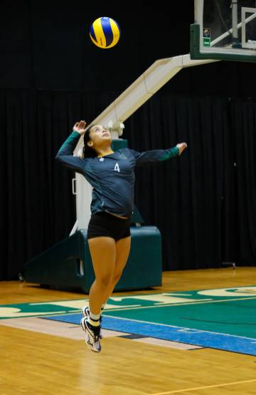 Samyra Tate Duenas serves for the UOG Tritons