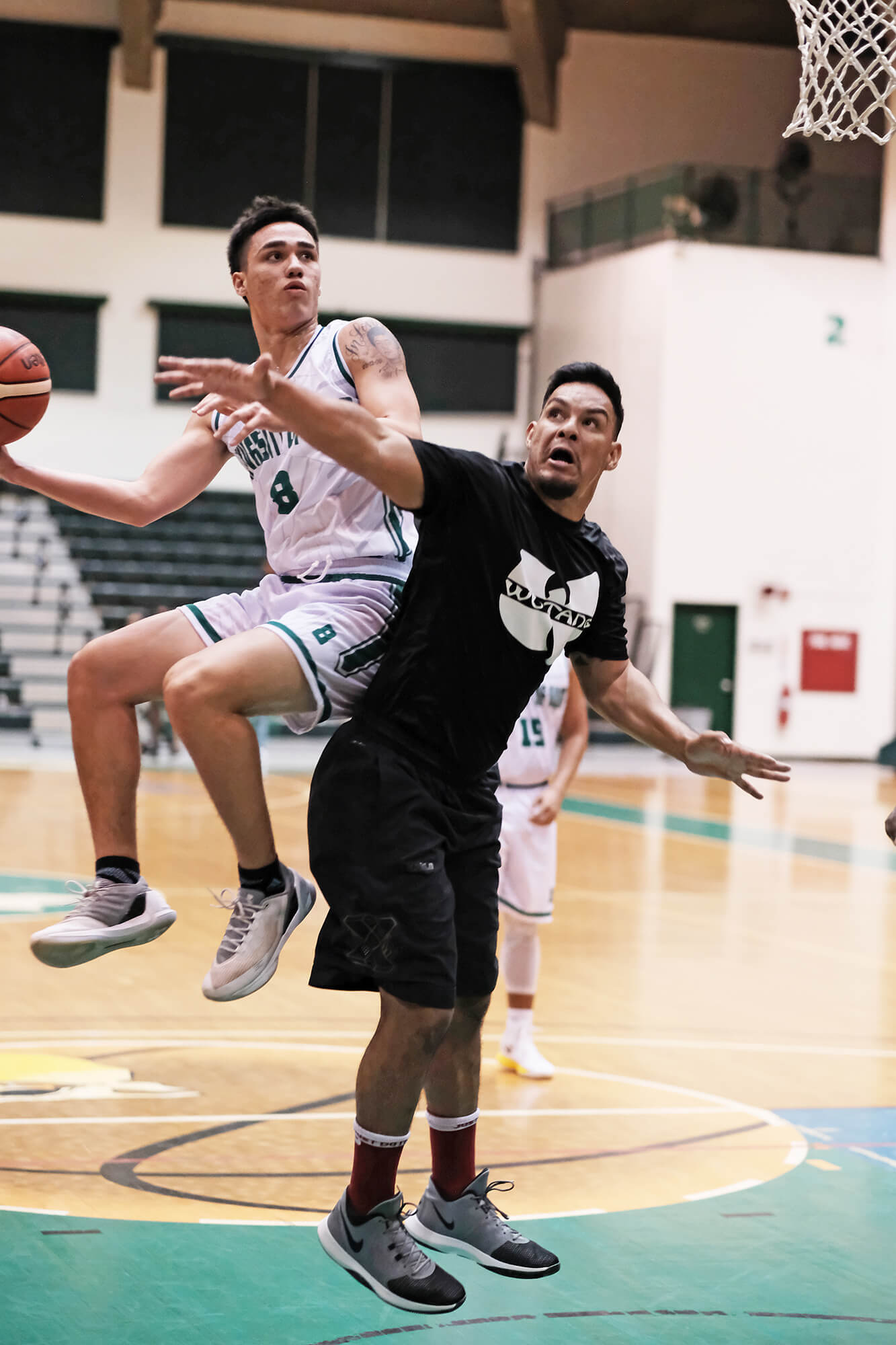 Tritons guard Michael Quan jumps for a hook shot over Team Wu-Tang forward Timothy Rodrigues