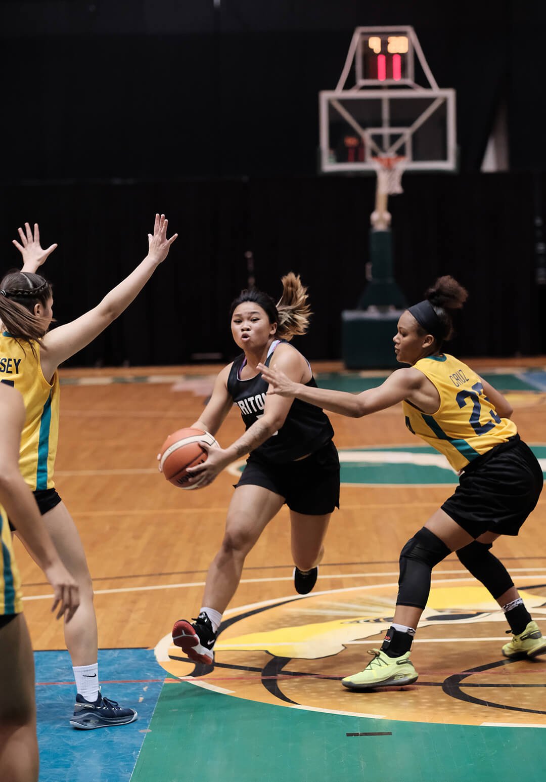Bulala Shanla (#5) makes a strong drive for the UOG Tritons.