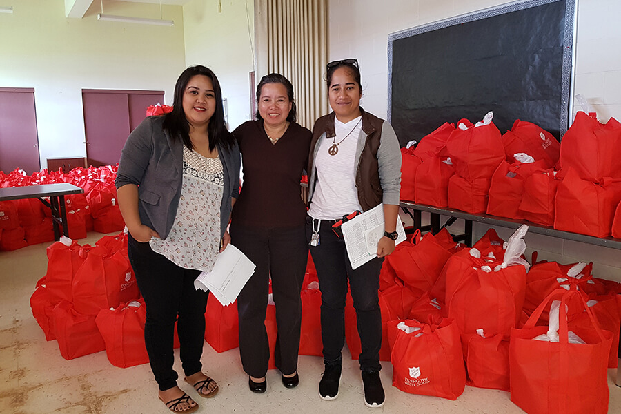 School of Health students bring mosquito repellant and nets to the homeless in Guam.