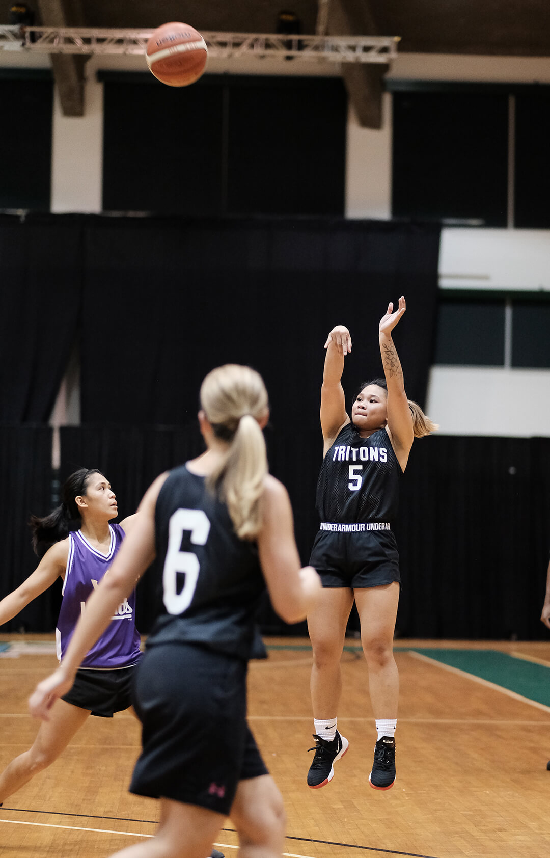 Shania Bulala takes a shot against an oncoming Team Legends defender