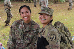 two ROTC cadets smile at the camera