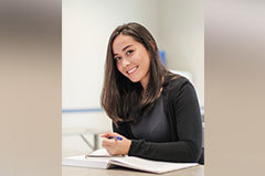 female student writer smiling for picture