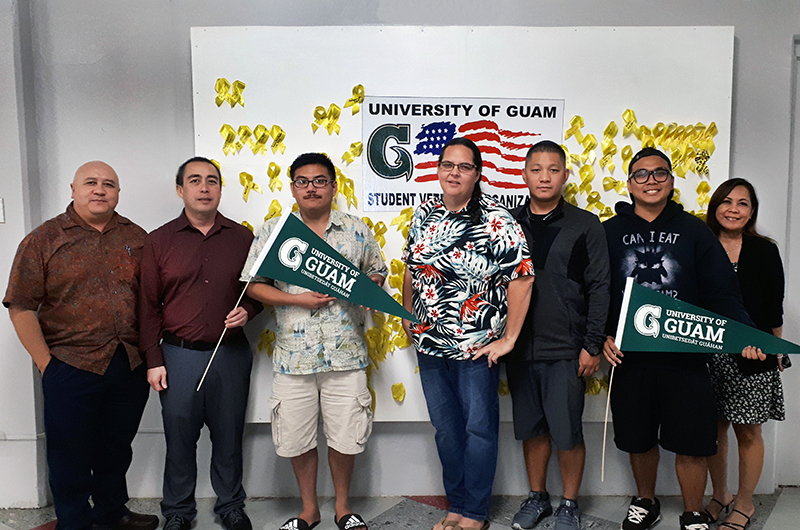 Veteran students at the University of Guam stand in the UOG Student Center