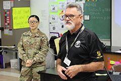 John Howerton, the recruiter for the UOG's ROTC program, with ROTC cadet Jeanie Nguyen