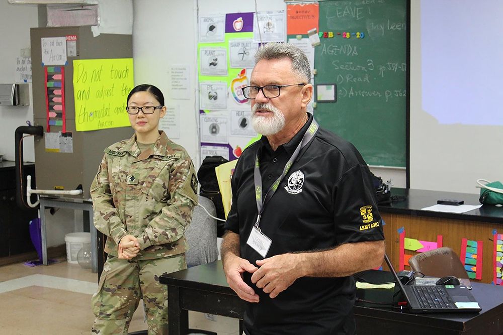 John Howerton, the recruiter for UOG’s ROTC program, with ROTC cadet Jeanie Nguyen