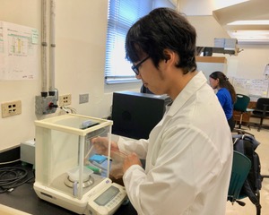 Chieriel Desamito examines soil samples in the lab for his master’s thesis. 
