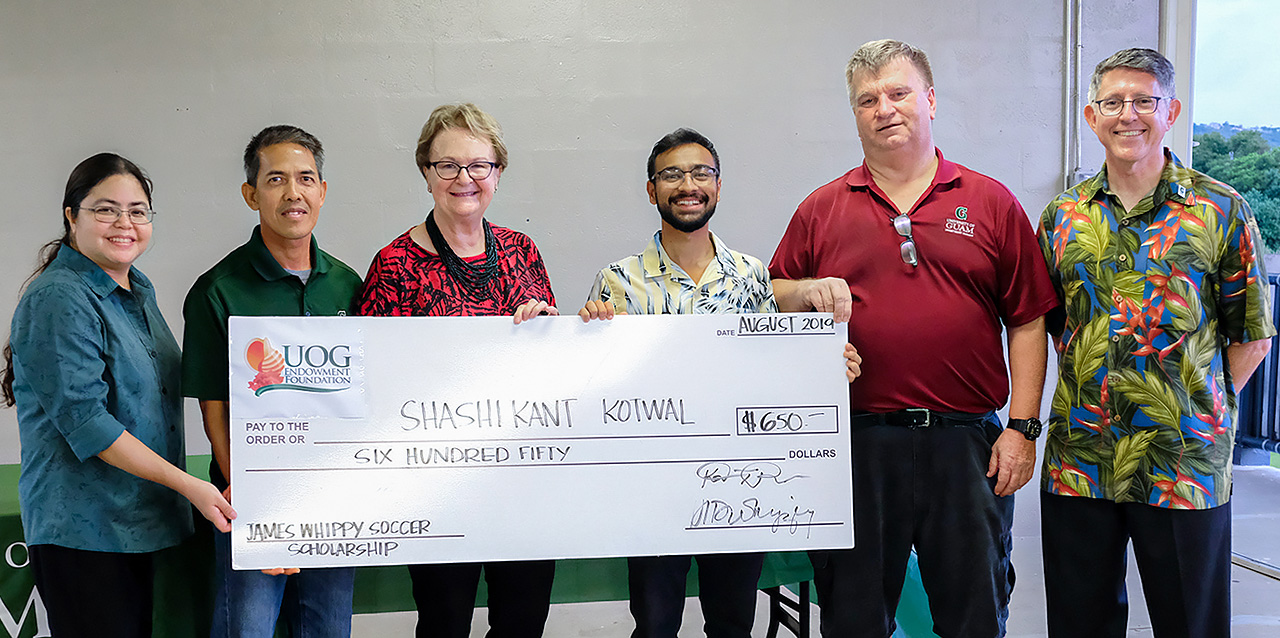 Shashi Kant Kotwal receives the james Whippy Soccer Scholarship.