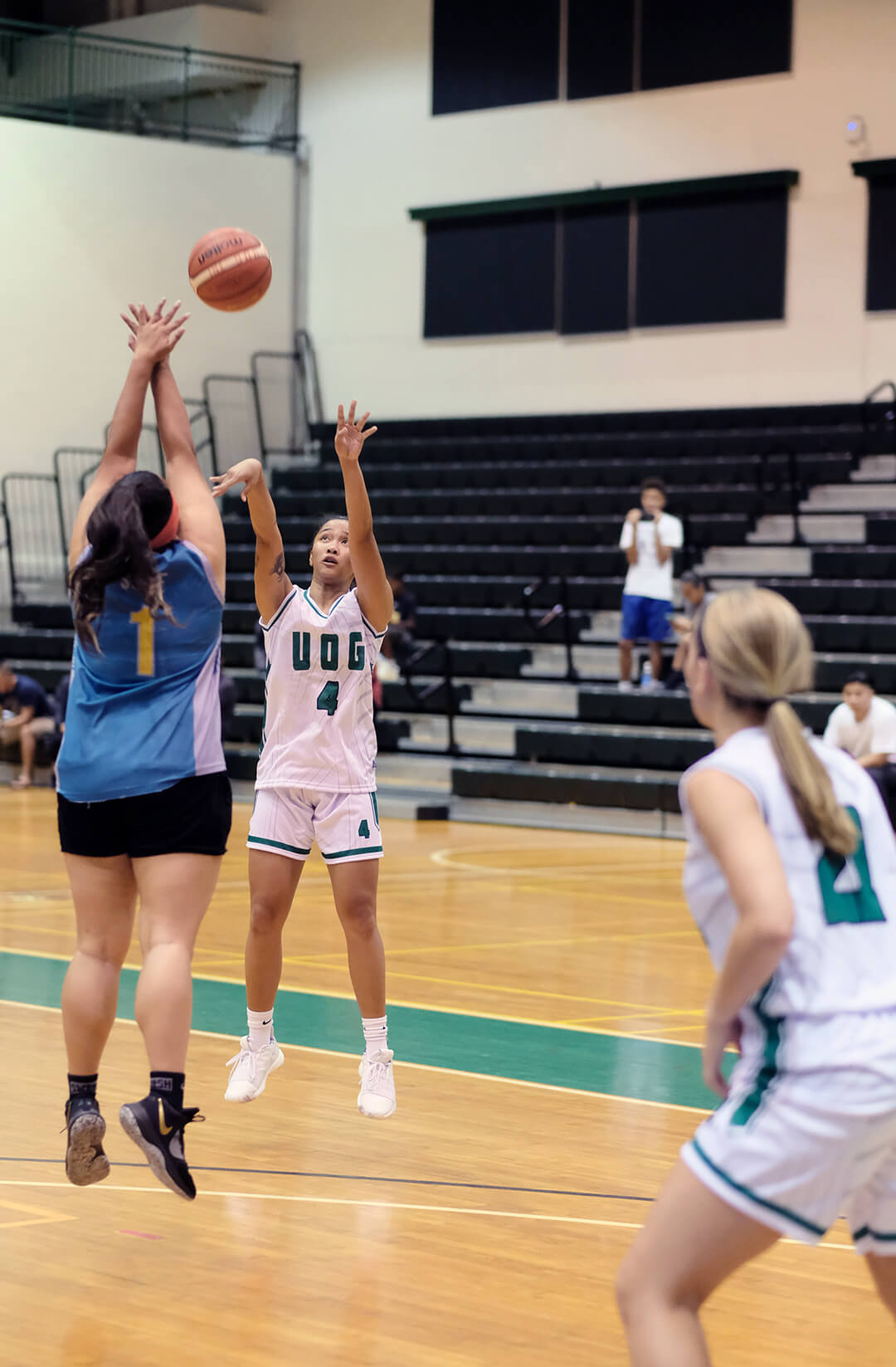 Tritons’ Persha Paige jumps above her opponent to make a shot.