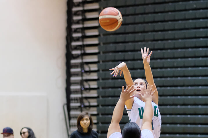 Tritons’ Persha Paige jumps above her opponent to make a shot.