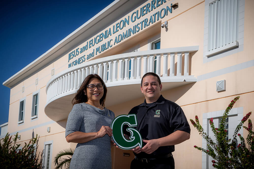 (From left) Annette T. Santos, dean of the SBPA, and Assistant Professor John J. Rivera