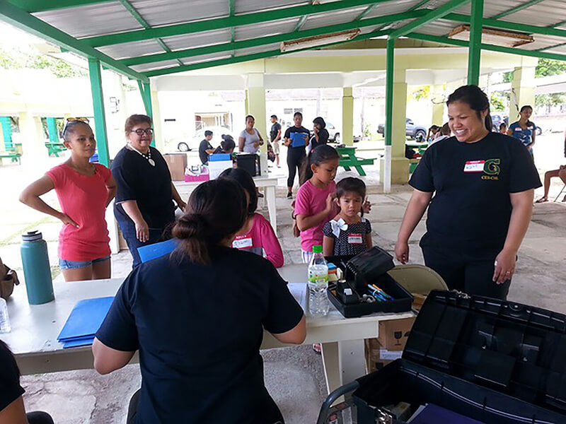 Photo of Remylynn Yamanaka helping children