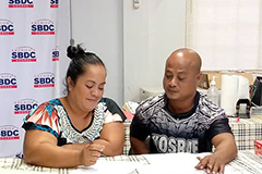 Sepe Tolenna and Tolenna M. Tolenna map a business plan during Startup Weekend Micronesia in Kosrae.