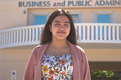 Photo of Tiera Santos in front of the SBPA building