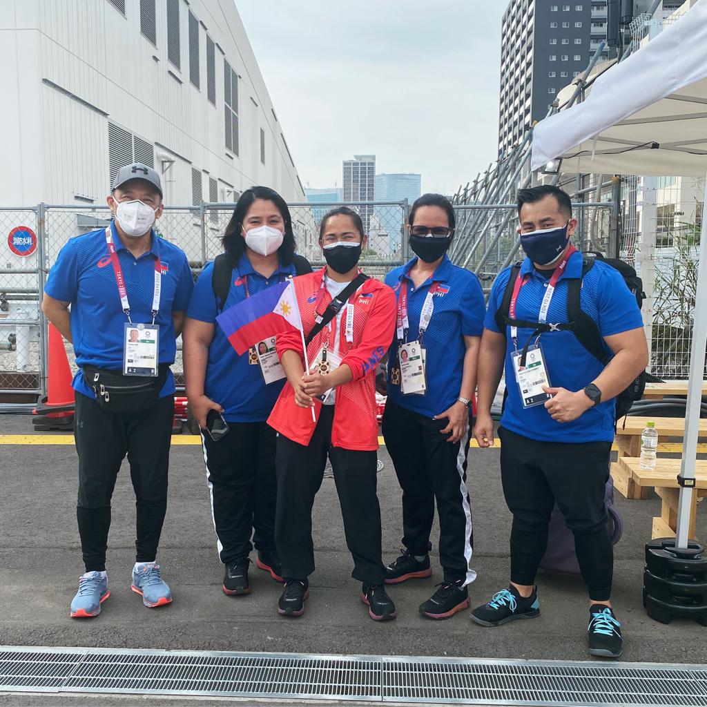 Olympic gold medalist Hidilyn Diaz with her team at the 2020 Tokyo Olympics
