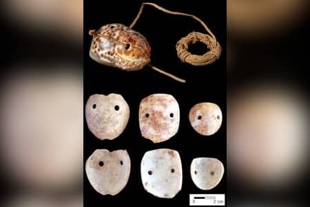 Research by Dr. Michael Carson dates cowrie-shell octopus lures to first settlements in 1500 B.C.