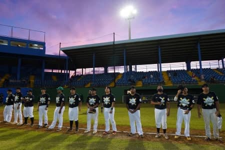 Group photo at baseball field