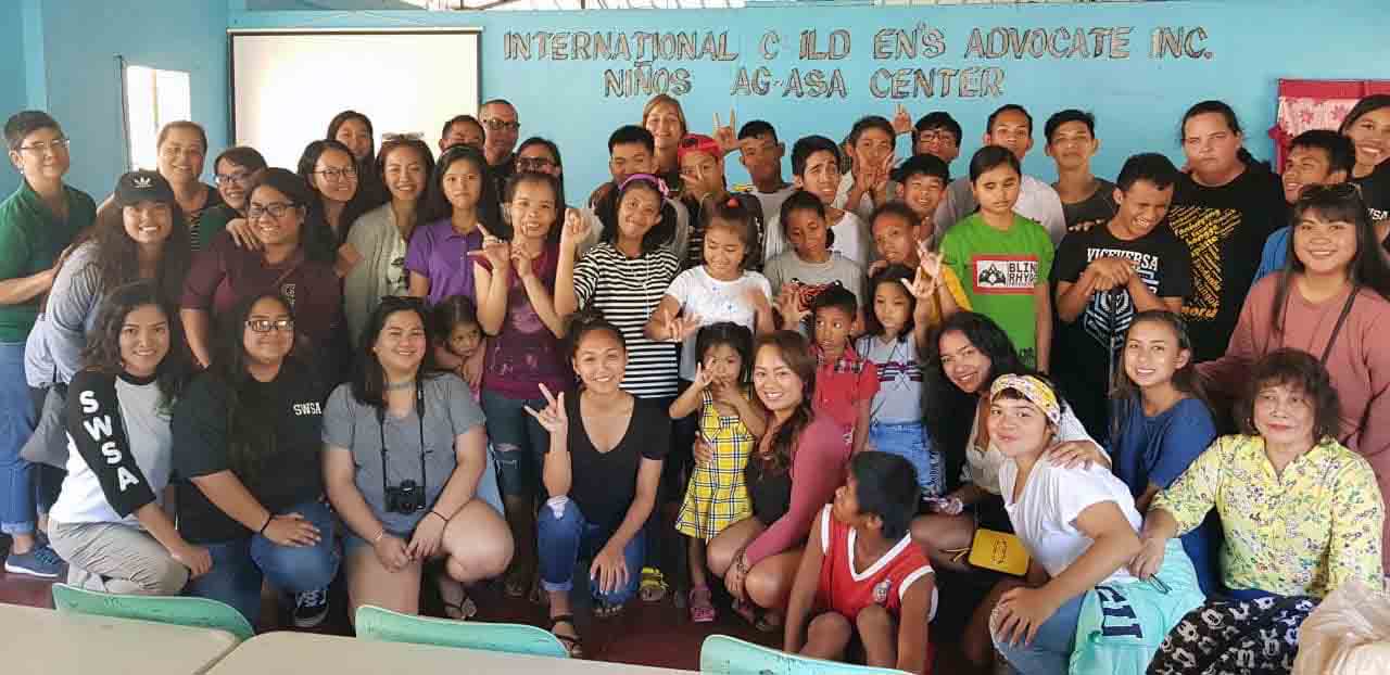 BSW students and faculty at International Children's Advocate Inc. in the Philippines