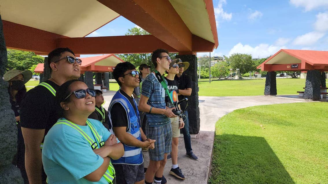 UOG Drone Corps members observe a drone in flight during a field practicum at the Gov. Joseph Flores Beach Park, also known as Ypao Beach Park.