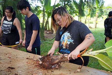 The class learned how to prevent the spread of plant diseases when transplanting banana suckers.