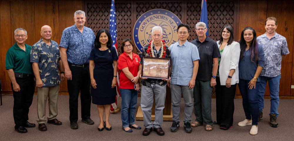 Colleagues and peers from within the University of Guam community join John W. Jenson