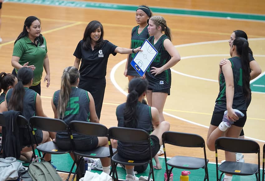 Head coach Cecile Olandez talks to her team during Monday night's game.