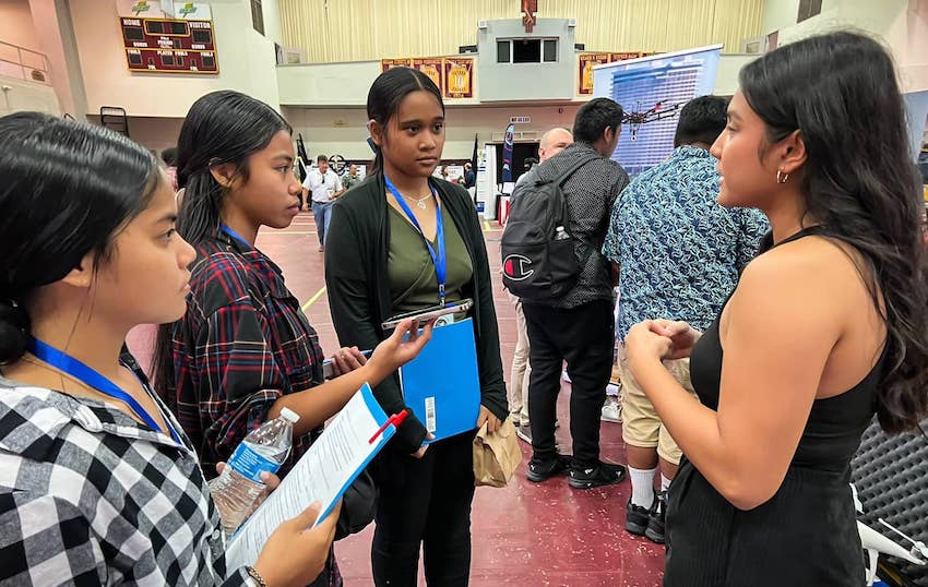 Photo of Jonelle Sayama speaking to students