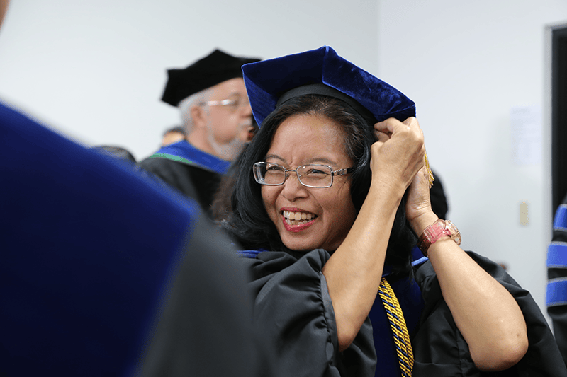 Photo of Dr. Hattori-Uchima in academic regalia