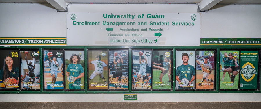 The wall, located in the UOG Calvo Field House, features the top Triton athletes from each sport.