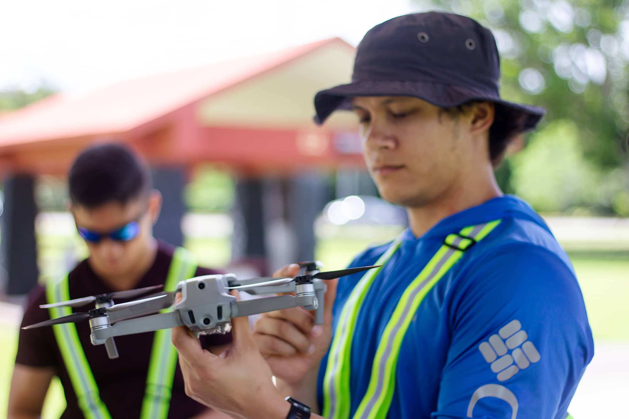 Francisco Camacho examines a drone 