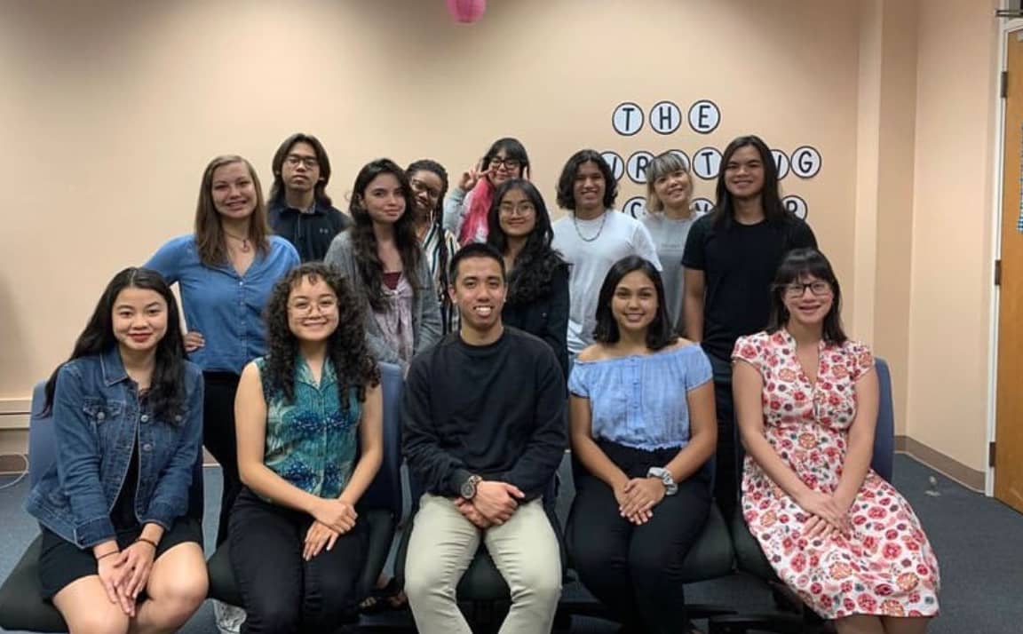 tutors pose with UOG student Nikko Angelo Capati for a photo in Division of English and Applied Linguistics Writing Center