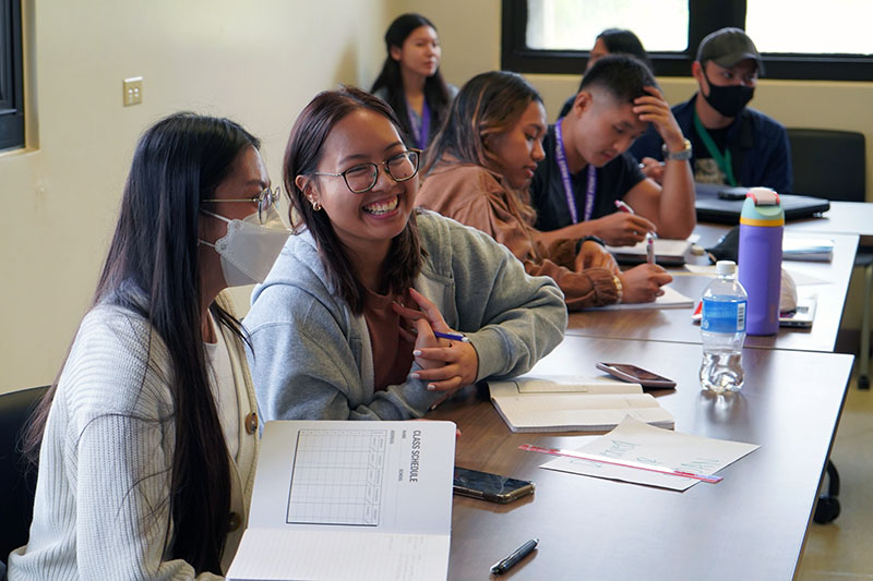 Photo of students laughing in a Sloan Foundation workshop