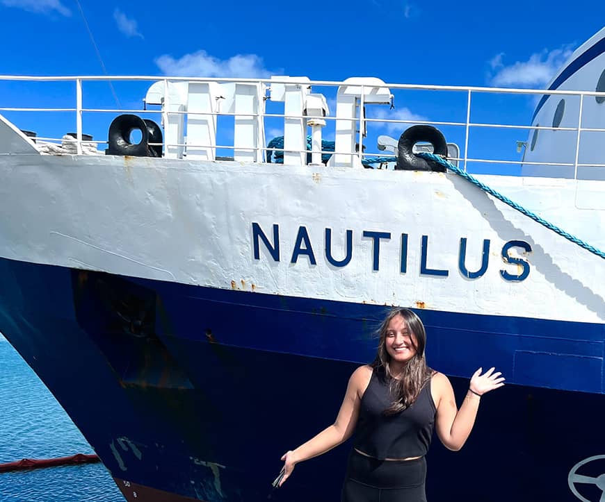 Gabriella Piper in front of research vessel