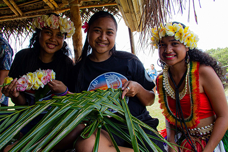 Photo of three female students from the UOG Chuuk Student Organization.