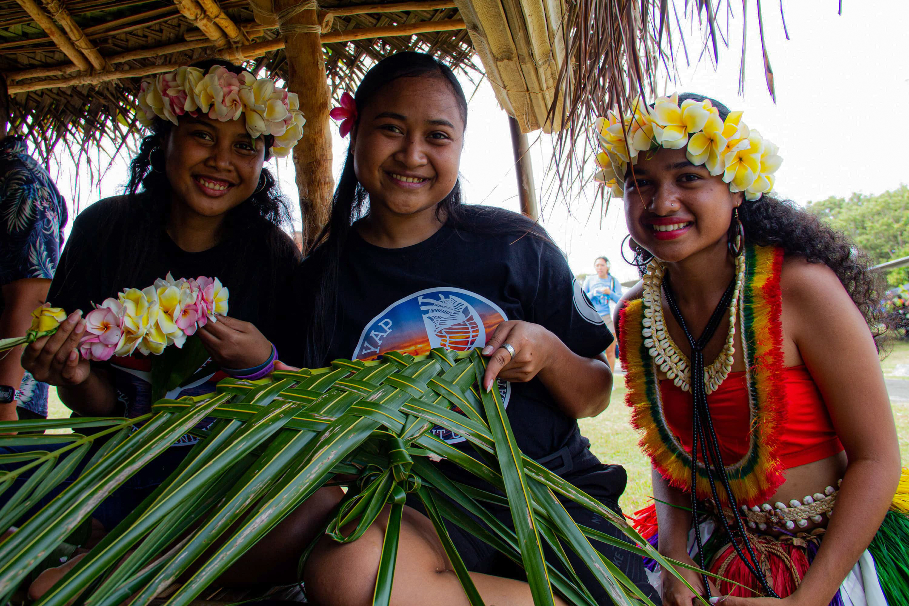 Photo of three female students from the UOG Chuuk Student Organization.